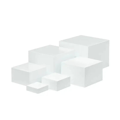 Six acrylic cubes in graduated sizes 3-8cm for dessert display, available in transparent or white