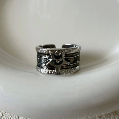 Geometric drop oil women's ring with adjustable band in distressed electroplated finish.