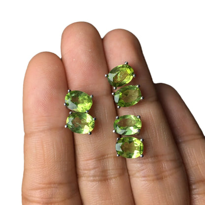 Close-up of grass green natural olivine stud earrings with geometric cut on S925 silver posts