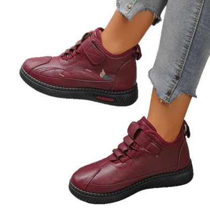 Women's black velvet indoor shoes with non-slip rubber soles and hollow out detail.