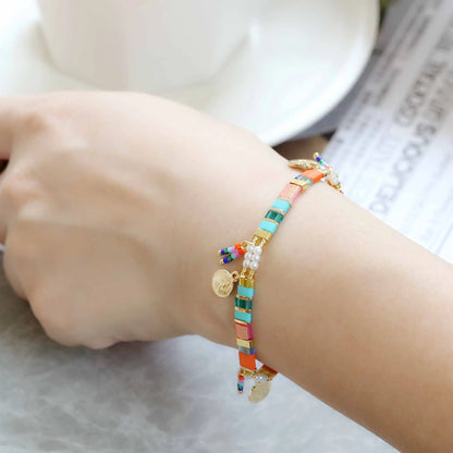 Women's handcrafted bracelet with imitation pearl and coloured glass beads in one of six colour styles.