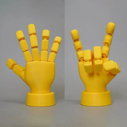 Yellow movable joint hand ornament showing articulated fingers and wrist joints