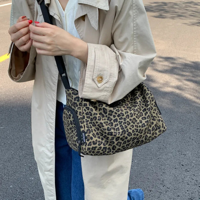 Leopard print sports style shoulder messenger bag with visible stitching and cross-body strap