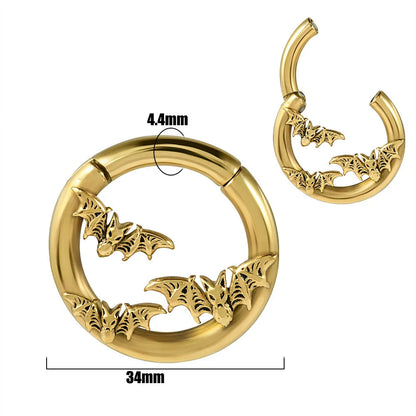 A pair of stainless steel fashion earrings featuring a totem pattern design in an electroplated colour.