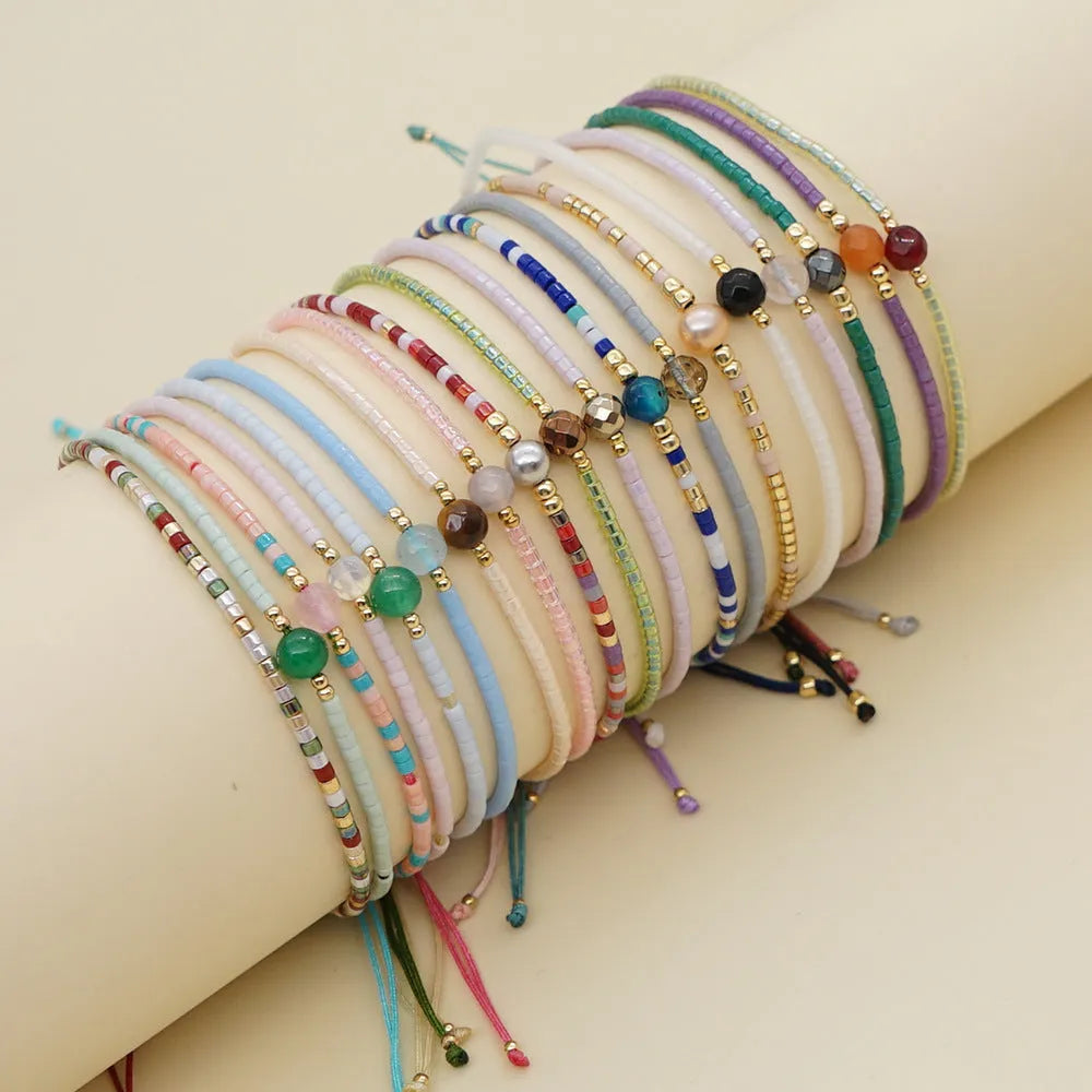 Handmade women's bracelet with colourful geometric glass and coloured glaze beads in Bohemian style.
