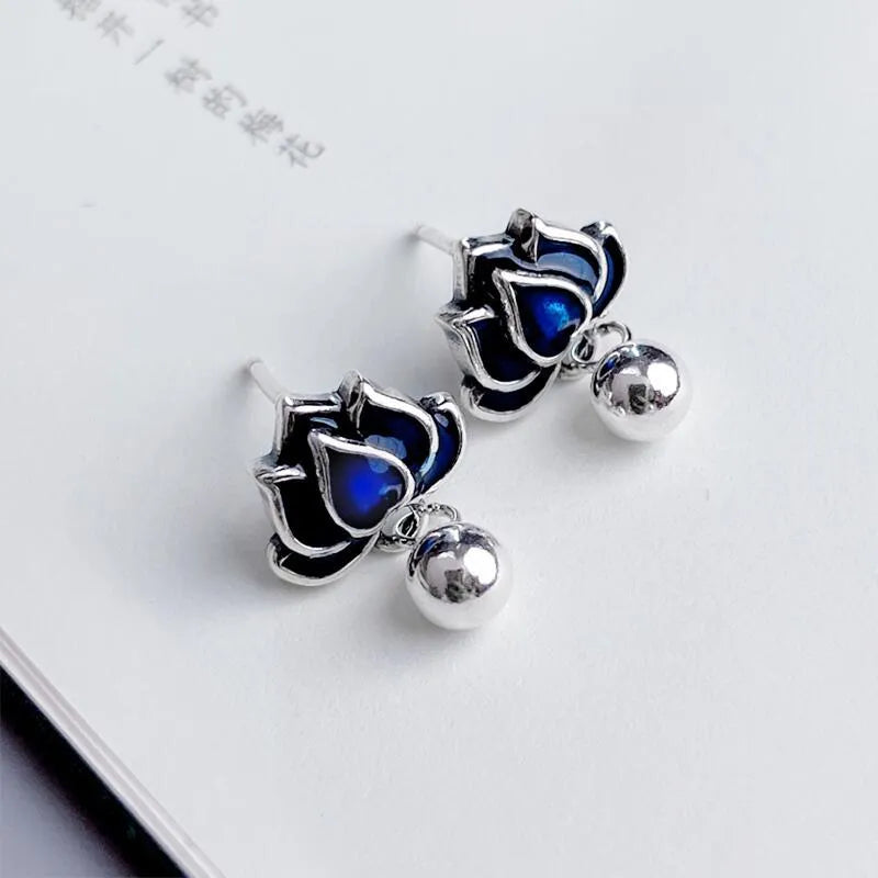 Blue Lotus Earrings with 1.2cm width lotus flower design and seedpod tassel detail