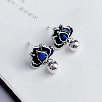 Blue Lotus Earrings with 1.2cm width lotus flower design and seedpod tassel detail