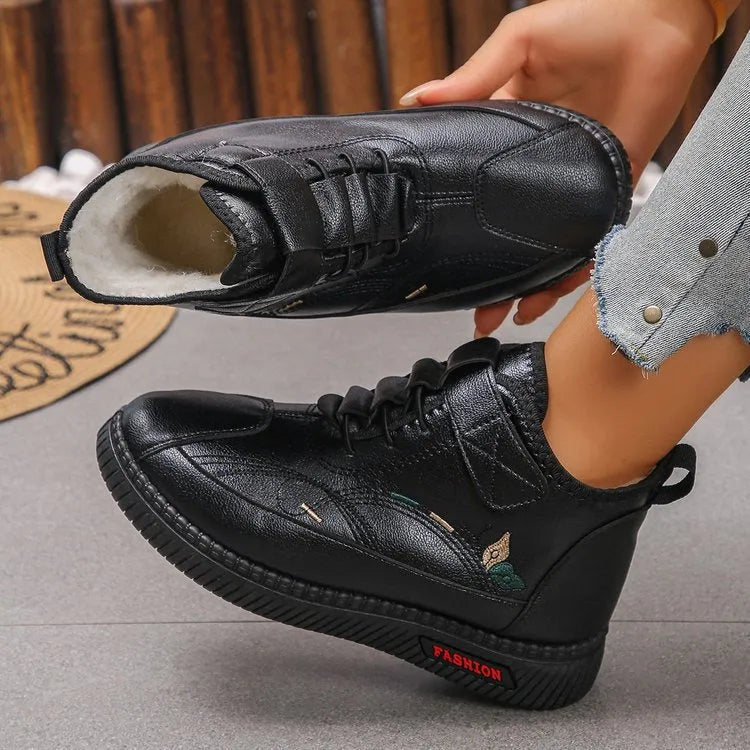 Women's black velvet indoor shoes with non-slip rubber soles and hollow out detail.