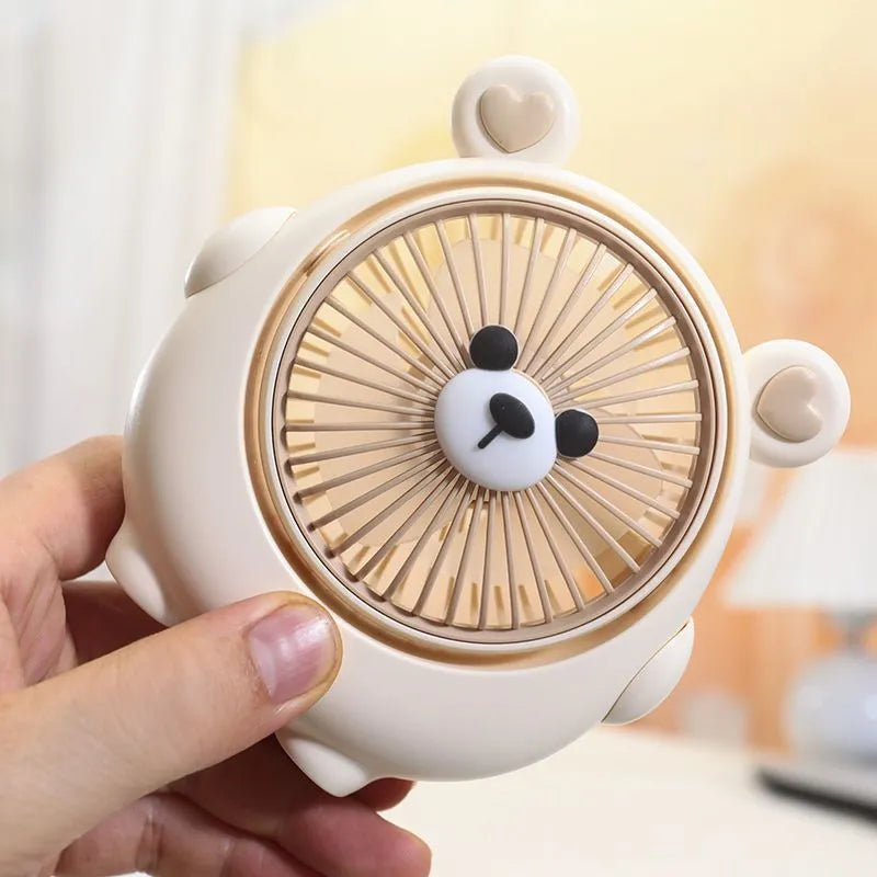 USB desktop fan with dog design showing three speed buttons and USB port, placed on a desk.