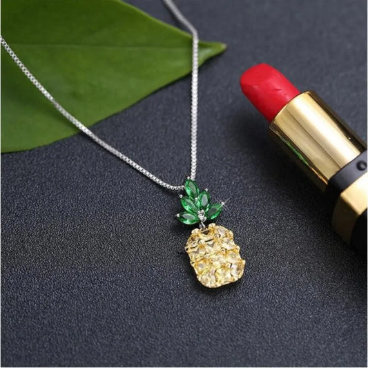 Geometric pineapple pendant necklace with silver and copper white gold plated finish on model