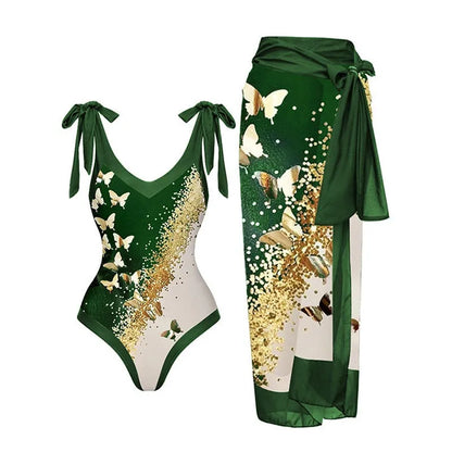 Women's solid colour one-piece swimsuit with spaghetti straps and a matching skirt.