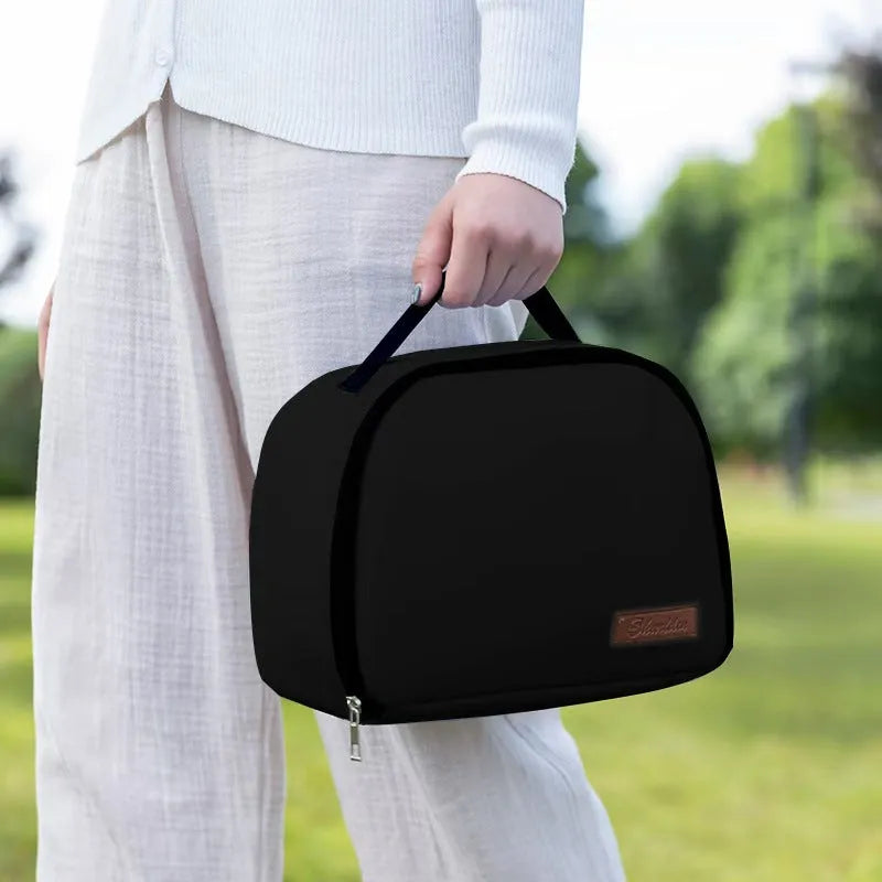 Insulated lunch box bag in sapphire blue textured cloth, shown with a lunch box inside.