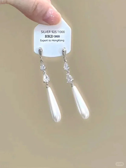 Geometric star-shaped alloy ear clip with rhinestones and hanging tassels for women