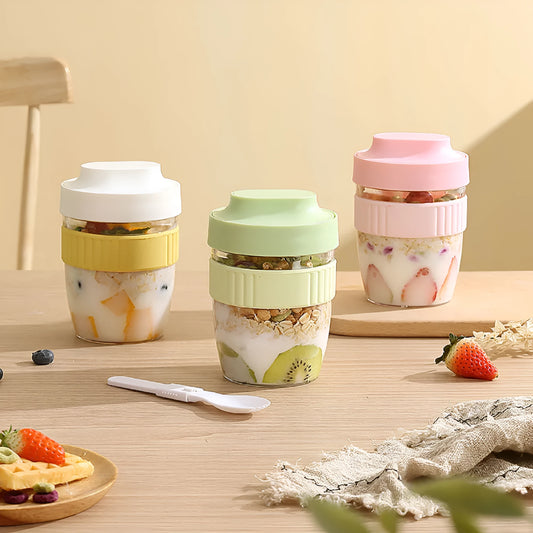 Green PP plastic salad cup with attached lid and spoon on a white background.