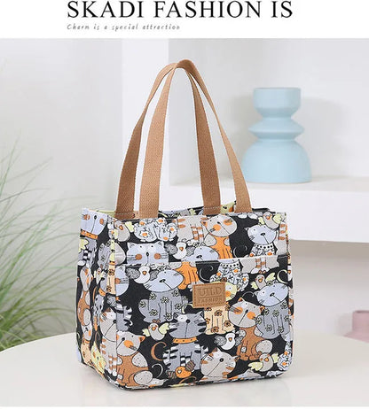 Women's portable printed canvas bag in horizontal square shape with floral design, showing reinforced base and large capacity.