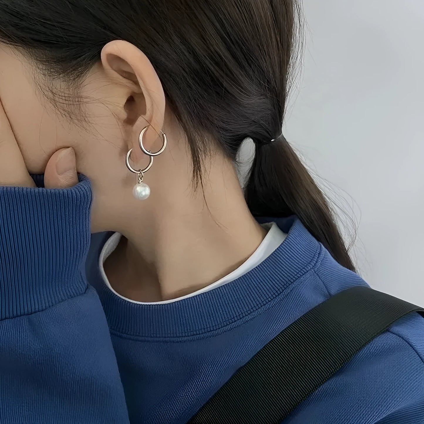 Geometric round pearl drop earrings for women with alloy metal and titanium steel posts.