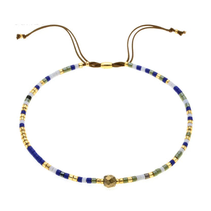 Handmade women's bracelet with colourful geometric glass and coloured glaze beads in Bohemian style.