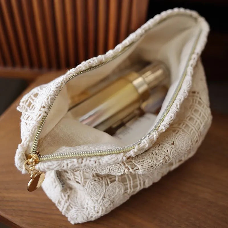 Handmade crocheted corduroy cosmetic bag with hollow flower embroidery in a rope style