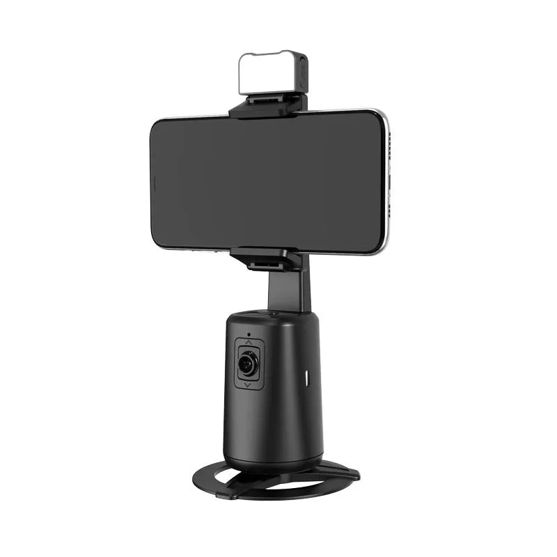 Black desktop phone holder with intelligent face tracking, rotating camera head, and ribbon LED lighting