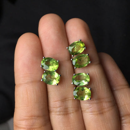 Close-up of grass green natural olivine stud earrings with geometric cut on S925 silver posts