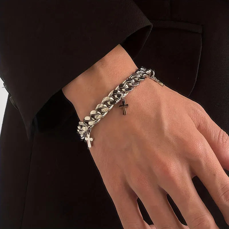 Men's titanium steel bracelet with a geometric cross charm on a black background.