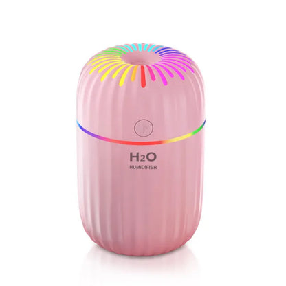 Mini USB aromatherapy humidifier in green, pink or white with 75x75x116mm dimensions and 0.5L water tank