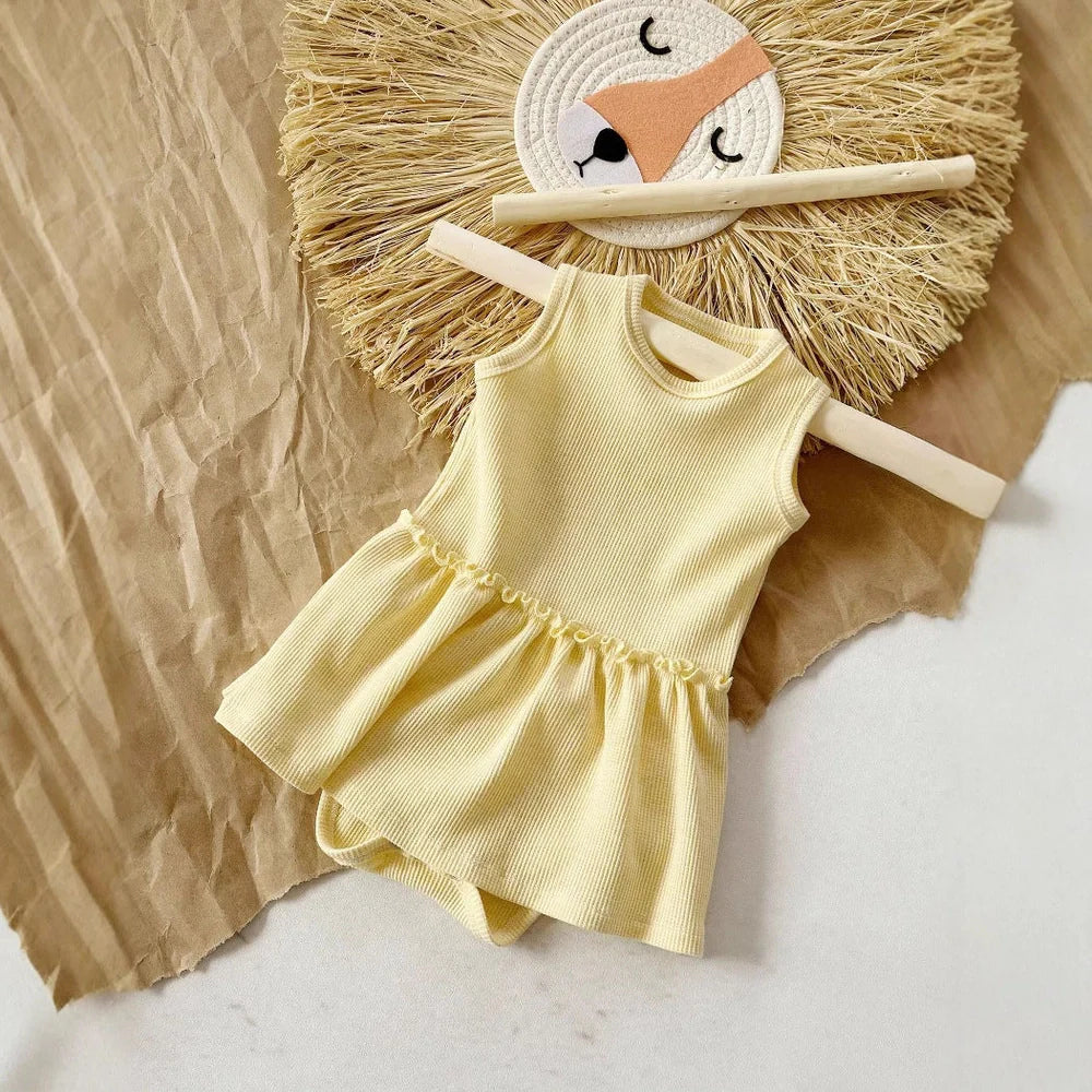 Baby girl wearing pink sleeveless vest onesie with waffle cotton texture and single-breasted closure