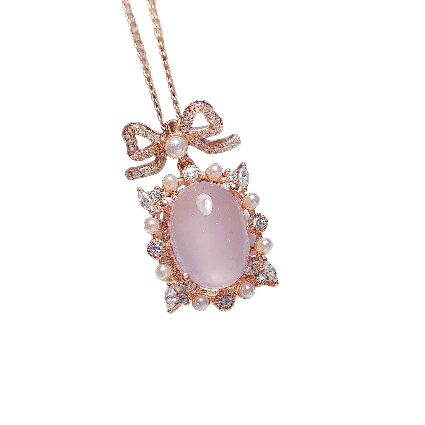 Geometric rose quartz pendant necklace on sterling silver chain with rose gold plating.