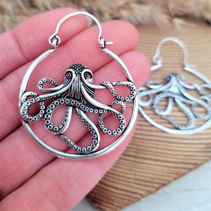 Close-up of vintage-style octopus earrings in antique silver colour with zinc alloy construction.