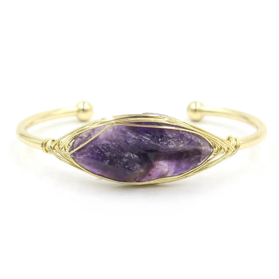 Natural raw gemstone bracelet with 8mm rough crystal beads in ethnic style, shown on wrist.