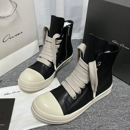 Black high-top leather sneakers with side zipper, round toe, and stitching details on genuine cowhide upper
