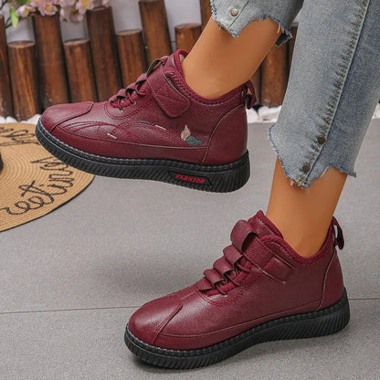 Women's black velvet indoor shoes with non-slip rubber soles and hollow out detail.