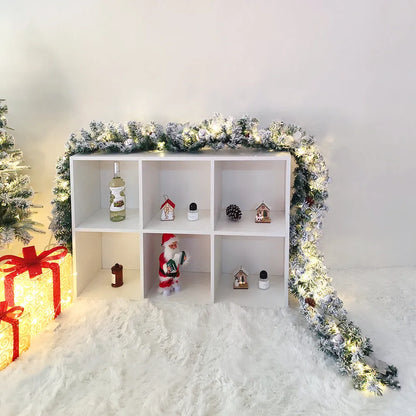 PVC Christmas rattan garland with flocked decoration in golden colour, draped as a festive vine.