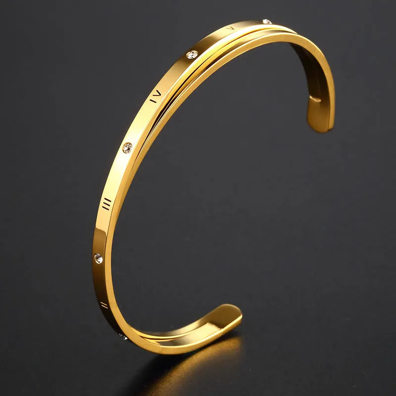Women's open-ended stainless steel bracelet with a central inlaid zircon stone in rose gold colour.