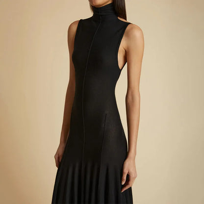 Grey women's slim-fit cotton dress with a half turtleneck neckline, backless design, high waist, and sleeveless cut.