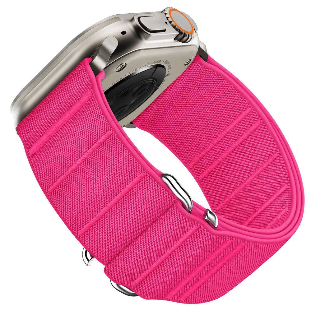 Elastic nylon Apple Watch band in Army Green with stainless steel buckle, shown on a wrist.