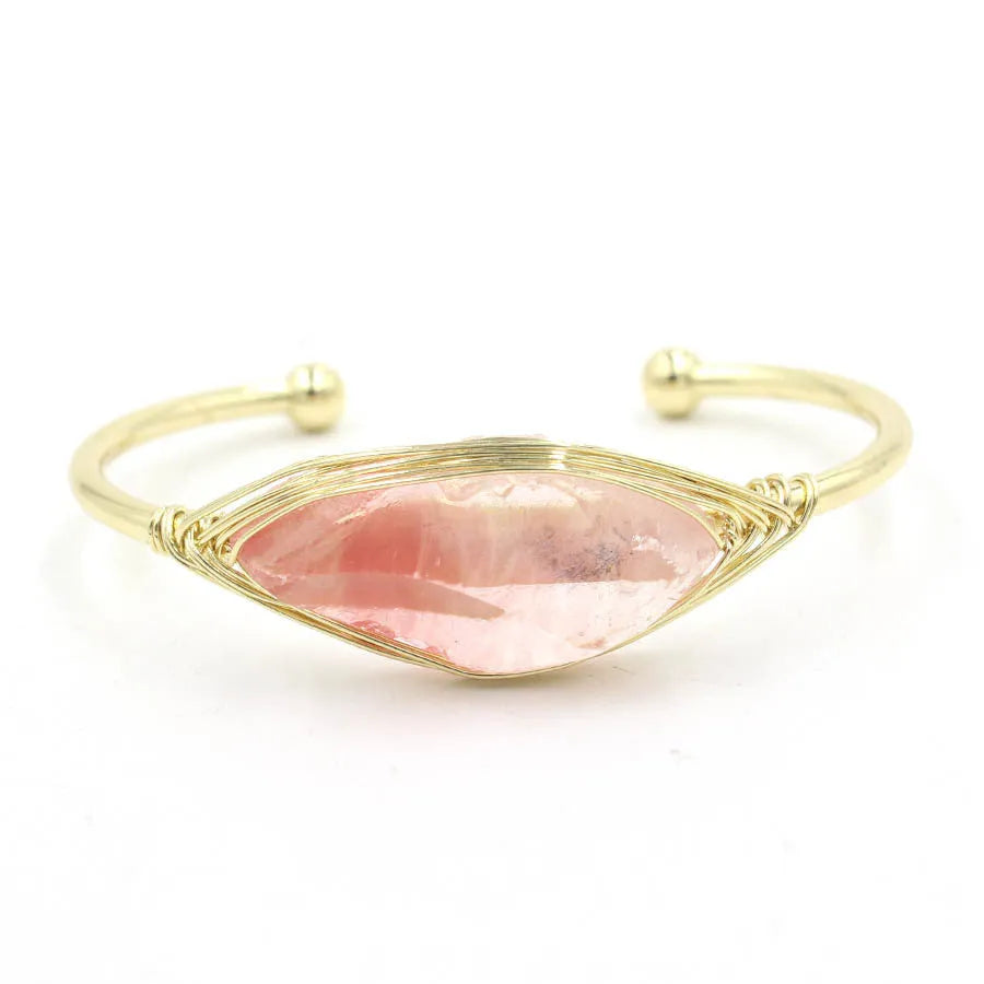 Natural raw gemstone bracelet with 8mm rough crystal beads in ethnic style, shown on wrist.