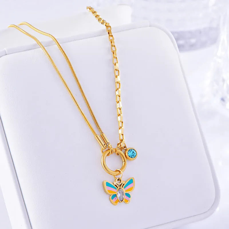 Gold titanium steel jewellery set with colourful epoxy butterfly pendant necklace and matching bracelet