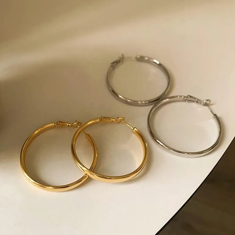 Gold and silver tone 40mm metal circle earrings with electroplated finish