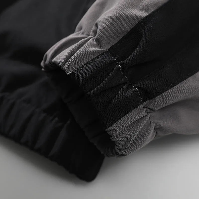 Men's black casual jacket with contrast stitching and side seam pockets for outdoor wear