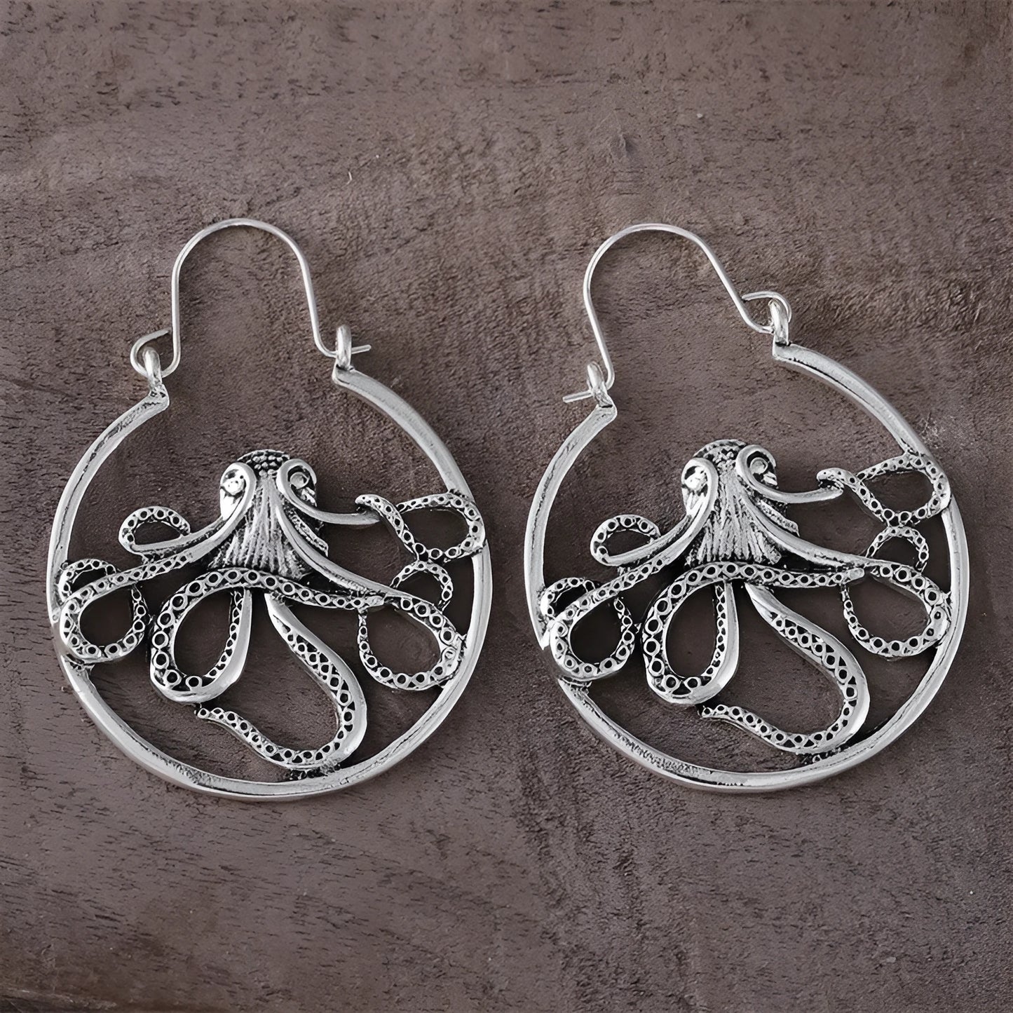 Close-up of vintage-style octopus earrings in antique silver colour with zinc alloy construction.