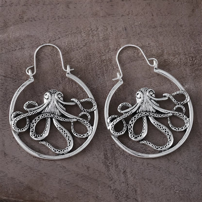 Close-up of vintage-style octopus earrings in antique silver colour with zinc alloy construction.