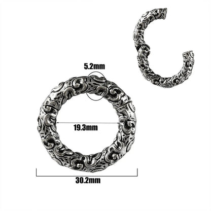 A pair of stainless steel fashion earrings featuring a totem pattern design in an electroplated colour.