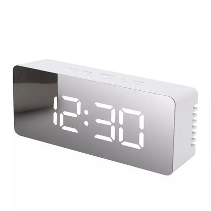 LED Digital Mirror Alarm Clock with customizable light colors on a desktop