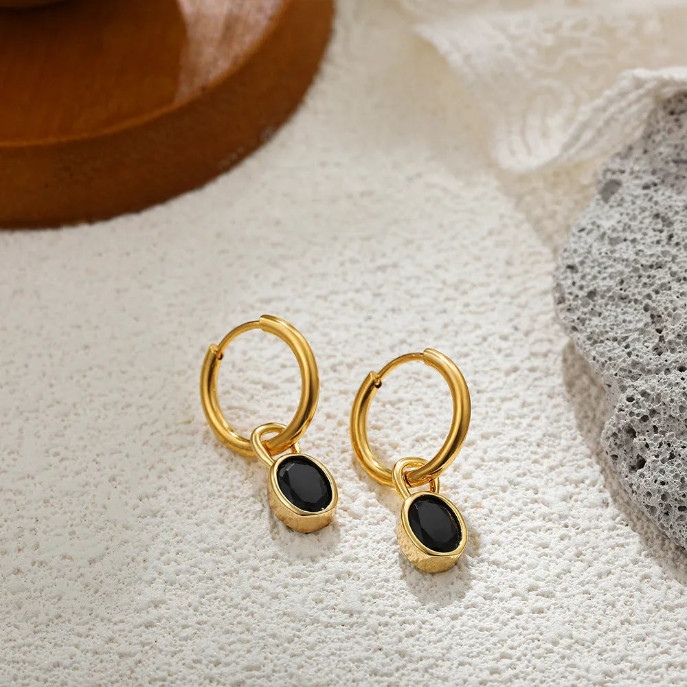 Women's copper oval earrings in six colour options showing elliptical 1.5cm retro design