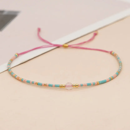 Handmade women's bracelet with colourful geometric glass and coloured glaze beads in Bohemian style.
