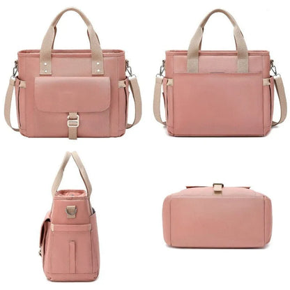 Insulated cube-shaped picnic bag with a removable shoulder strap in pink, shown with a side pocket.