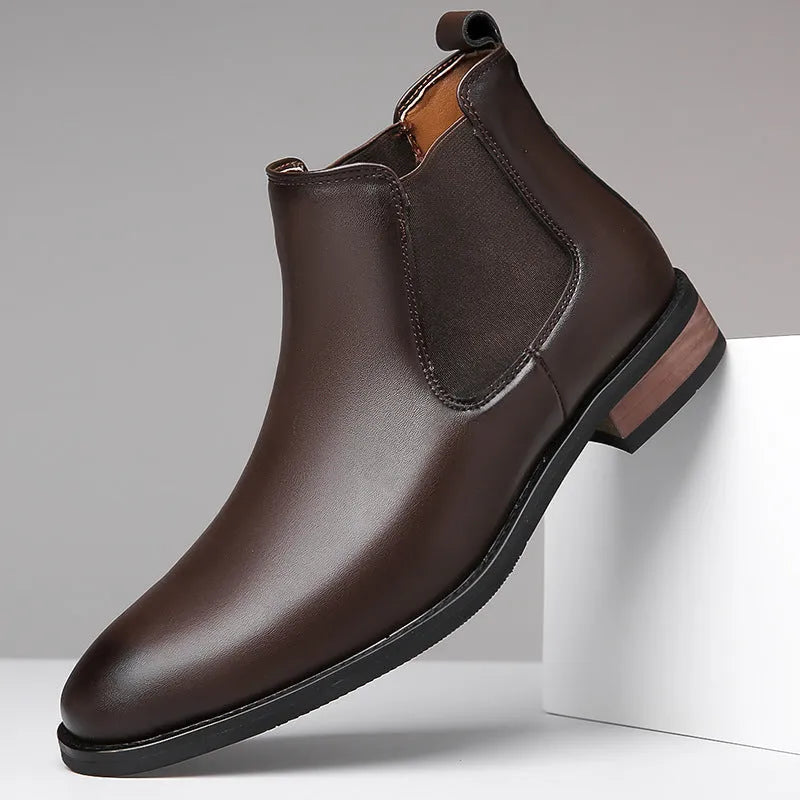Men's black pointed toe Chelsea boots with a decorative sewing thread detail on the artificial PU upper.