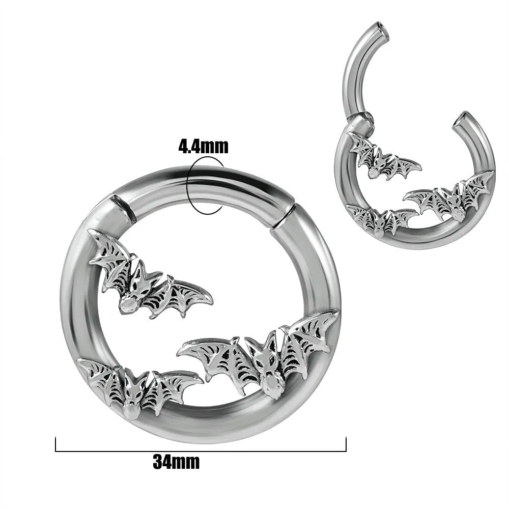 A pair of stainless steel fashion earrings featuring a totem pattern design in an electroplated colour.