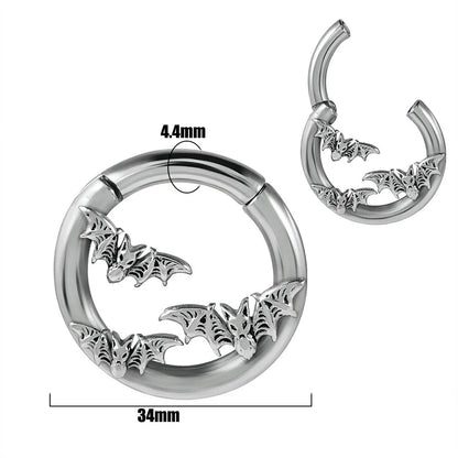 A pair of stainless steel fashion earrings featuring a totem pattern design in an electroplated colour.
